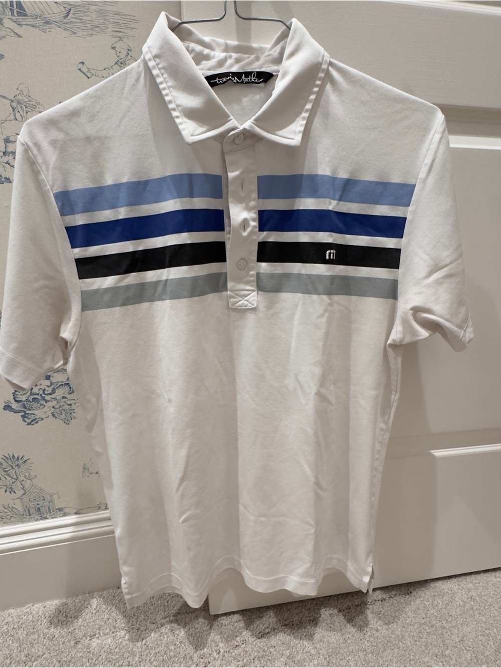 Travis Mathew Men’s White golf shirt with Blue Stripe Detail